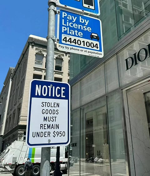 'Stolen Goods' sign outside a Dior store